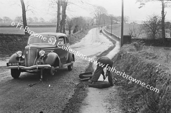 ON THE ROAD TO CORK CAR WITH PUNCTURE